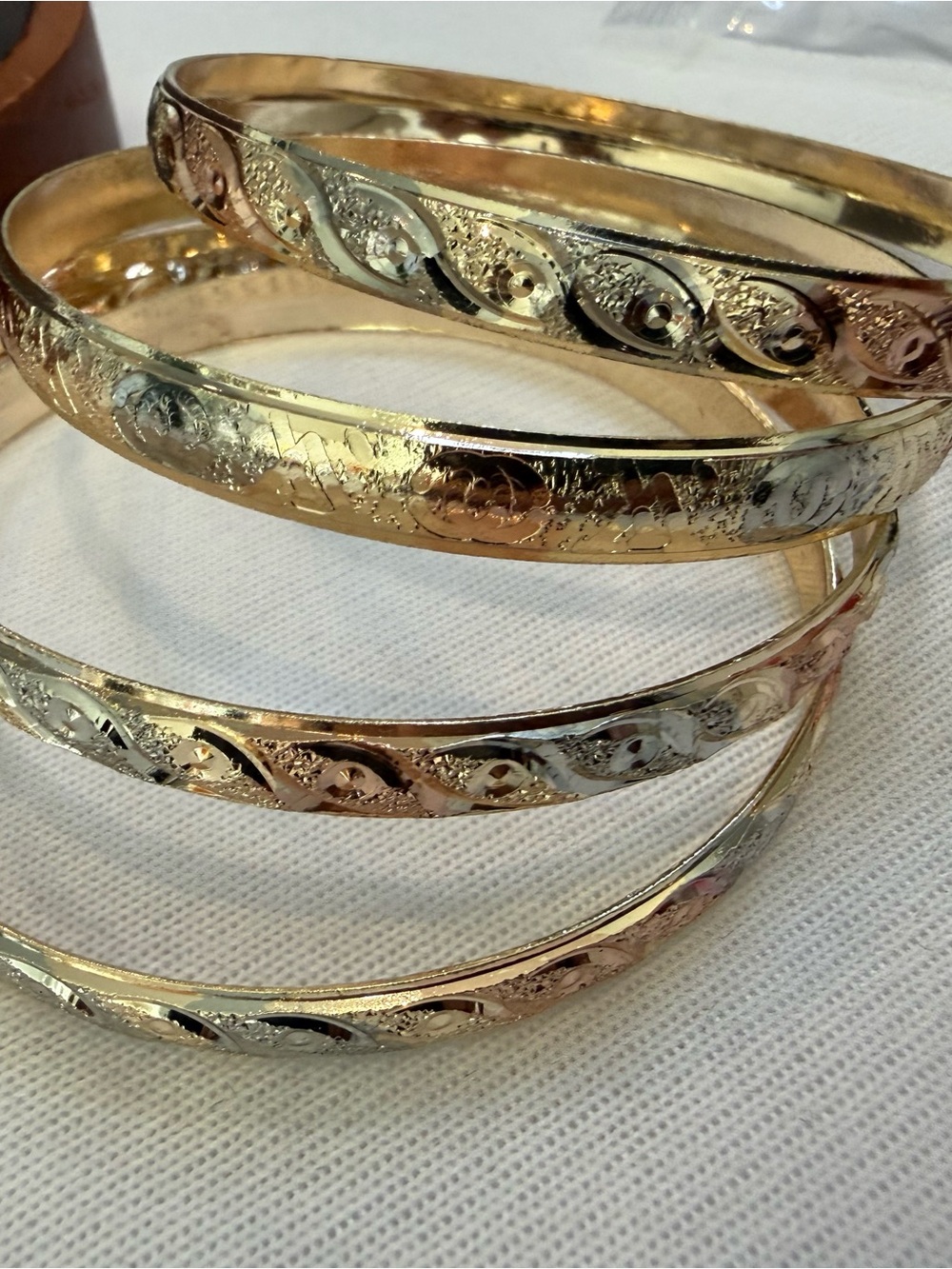 Gold-Tone Women’s Decorative Bangle Set of four.
